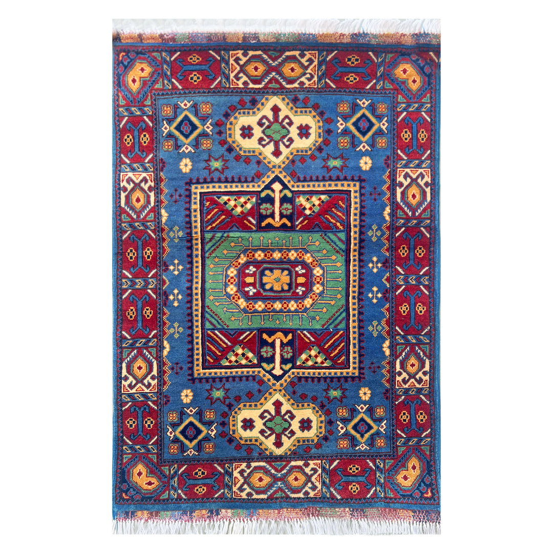 Afghan Herat Turkmen Chobrang hand-knotted carpet, deep cobalt blue field with green central medallion panel framed by ivory cartouches, crimson border