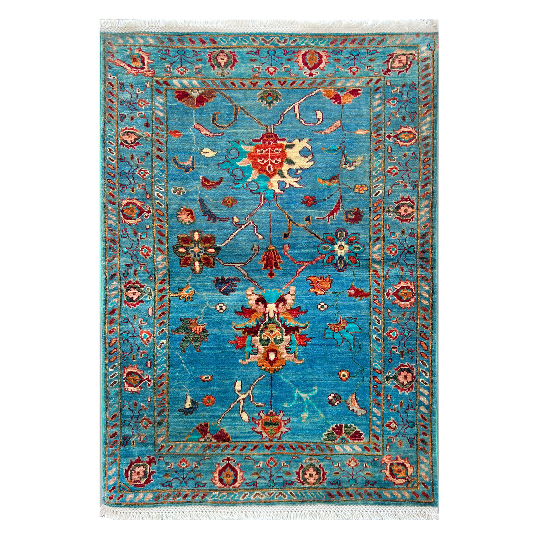 Afghan Kabul Hazara Chobi hand-knotted carpet, electric turquoise field with scattered botanical and figurative forms in crimson, orange, ivory and bottle green