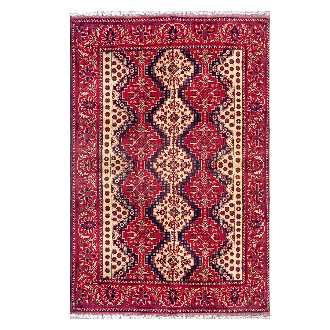 Afghan Mazar-e-Sharif Turkmen Yusufi hand-knotted carpet, vivid crimson field with elongated central ivory and navy medallion, wide botanical scroll border