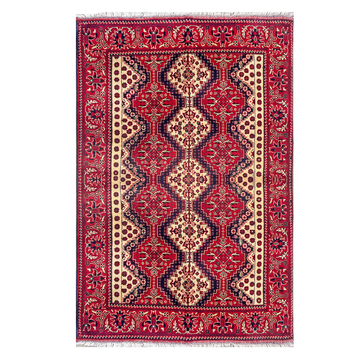 Afghan Mazar-e-Sharif Turkmen Yusufi hand-knotted carpet, vivid crimson field with elongated central ivory and navy medallion, wide botanical scroll border