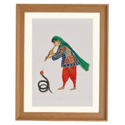 A female snake charmer plays the flute to rouse the snake Art Print